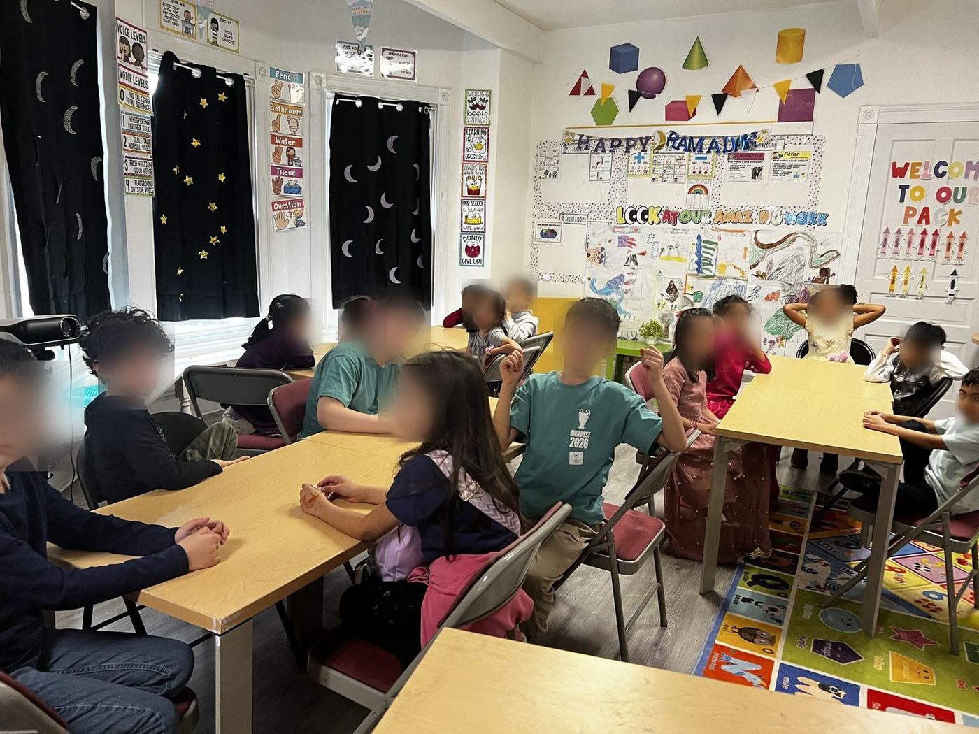 A classroom decorated for Ramadan with students at their tables