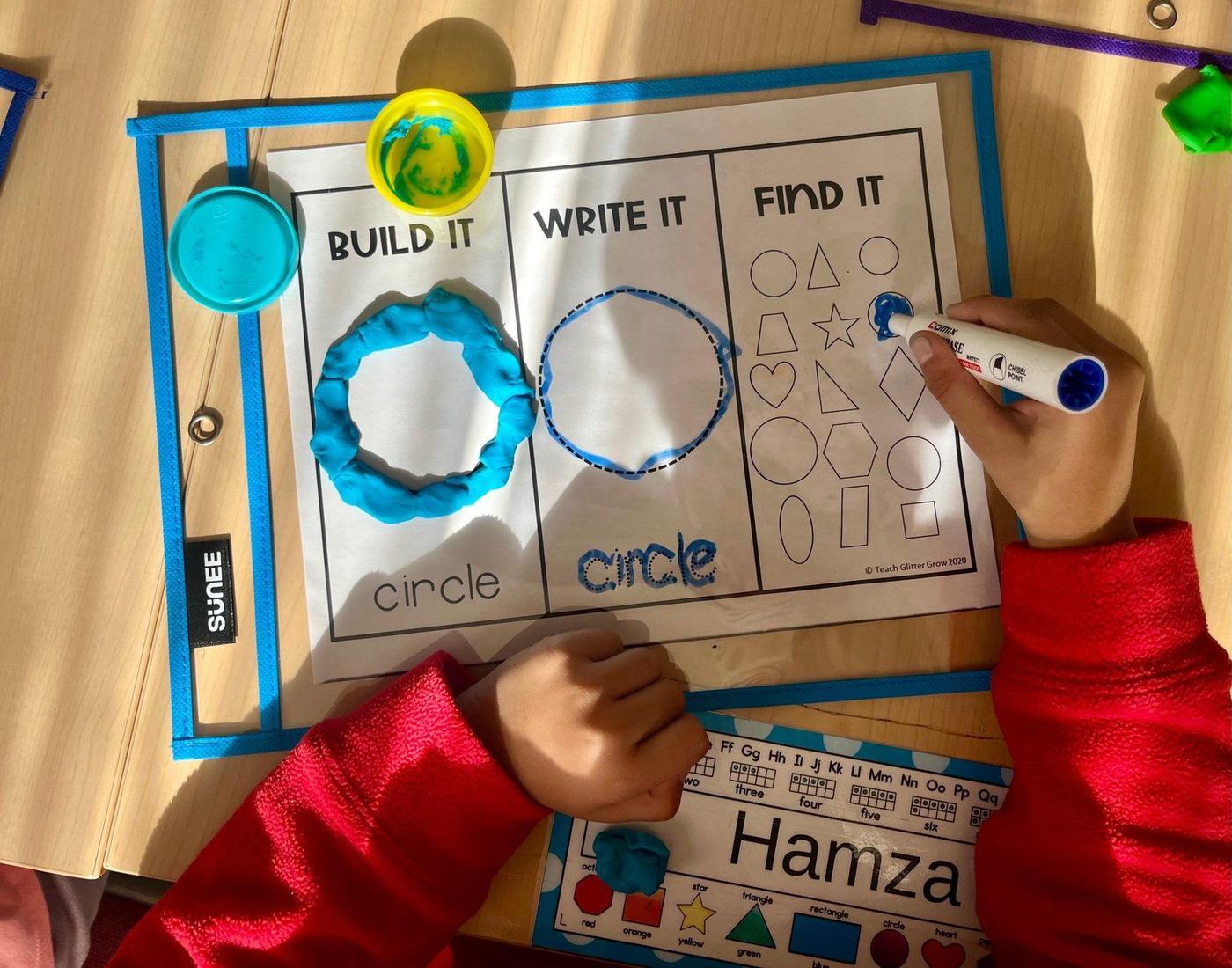 A student building, tracing, and finding shapes during early literacy work