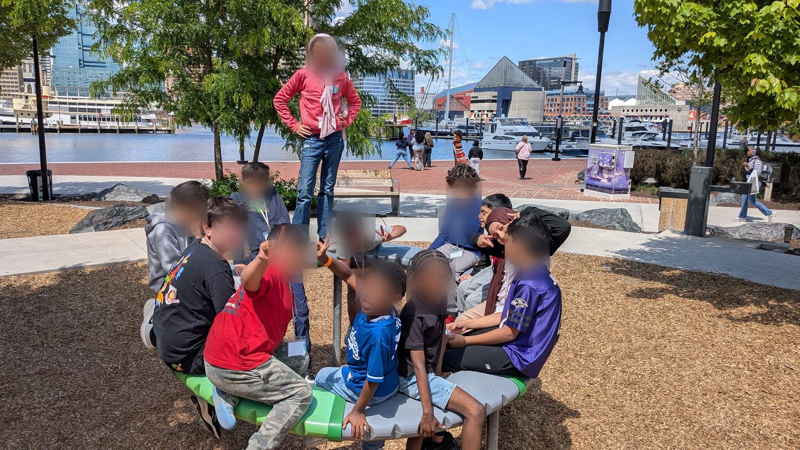 Students gathered at a playground at Baltimore’s Inner Harbor during a field trip