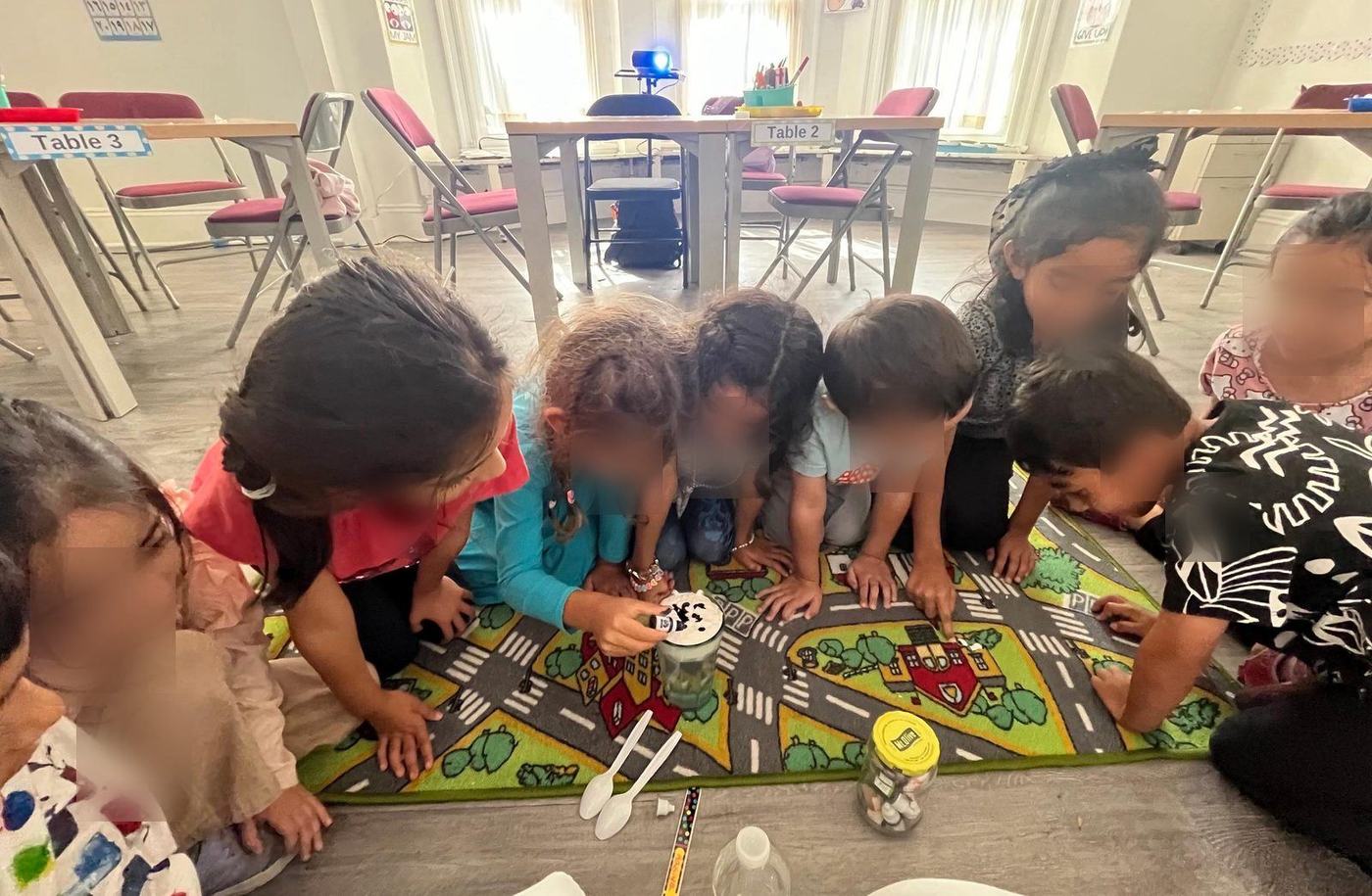 Students gathered around a fizzing science experiment
